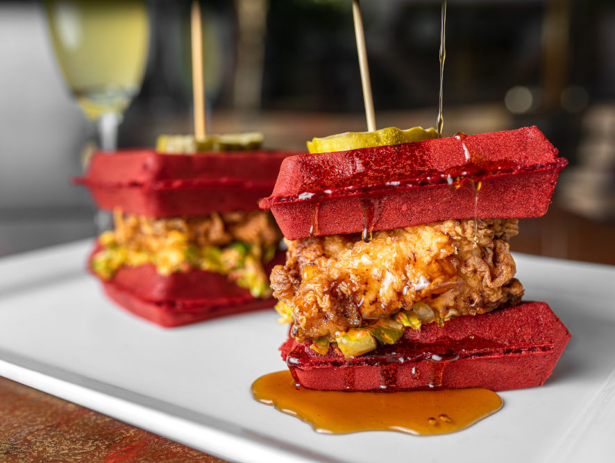 Red velvet chicken and waffle sliders with remoulade and shredded lettuce